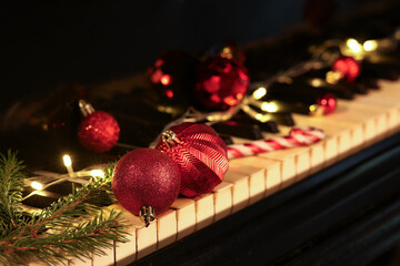 Red Christmas balls on piano keys