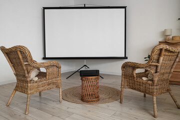 Interior of light room with armchairs and projector screen