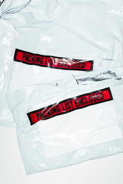 Transport package with duty tariff labels and documents and flashlight