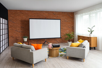 Interior of room with sofas, table and projector screen