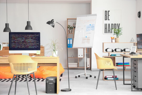 Interior of light programmer's office with desks and beanbags