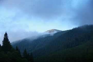 view of Mount Khomyak, in fog and clouds, Ukrainian Carpathians, Ukraine