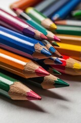 Fototapeta premium Colored pencils on white background. Close-up. Flatlay. Copy space 