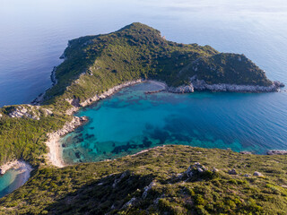 Aerial drone view of Beautiful Porto Timoni bay with twin beaches and turquoise waters on Corfu