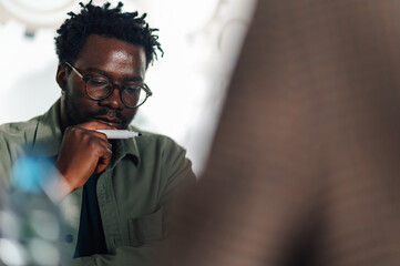 Pensive office worker concentrating during meeting