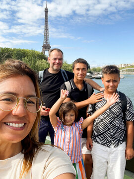 Family enjoying a sunny day near the Eiffel Tower 