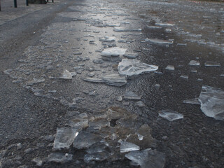 Shards of ice after flooding created black ice on the ground in Bonn, Germany