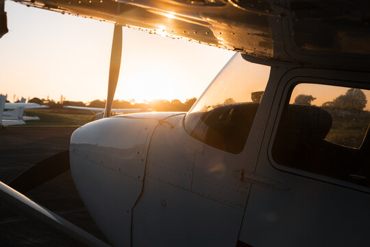 Side On View of  Light Training  Aircraft At Sunset  