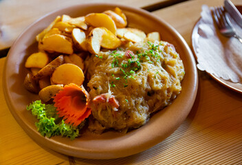 Pork ribs with stewed cabbage and baked potatoes - Polish cuisine