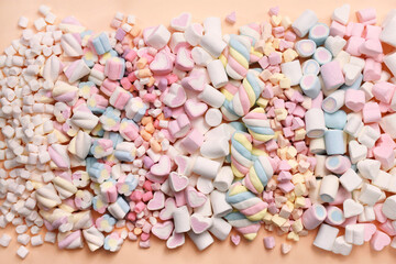 Confectionery and sweeties varieties background: light pink and white marshmallows, sugar confetti, bonbon and candies