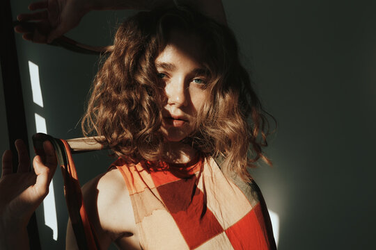 Portrait of gorgeous woman with curly hair 