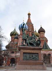 Fototapeta premium The Monument to Minin and Pozharsky is a bronze statue designed by Ivan Martos and located on the Red Square in Moscow, Russia, in front of Saint Basil's Cathedral.