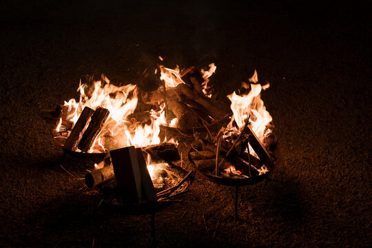 Wood burning in a brazier in a garden