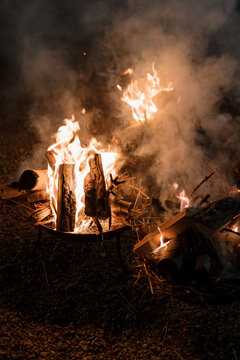 Wood burning in a brazier in a garden