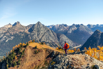 Female Hiker on Mountain Ridge with Fall Colors