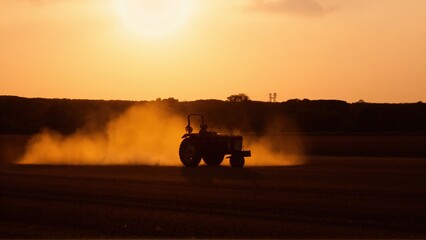 Fototapeta premium tractor on sunset