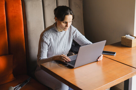 Blind woman using laptop with focus and concentration
