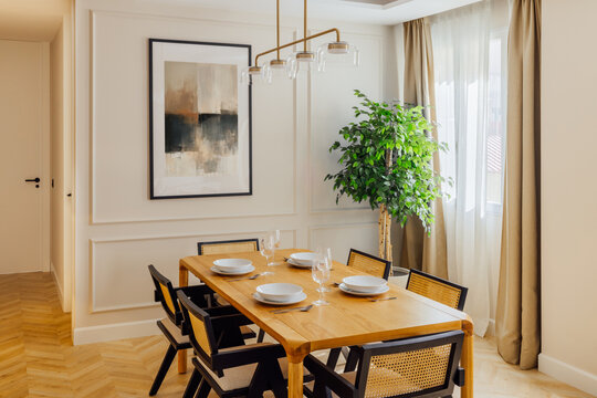 Elegant dining room with natural light and modern decor