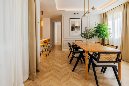 Modern dining room with wooden elements and natural light