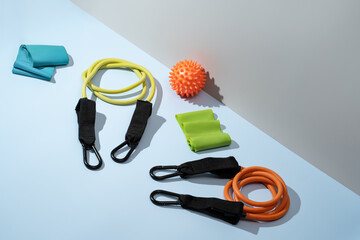 Variety of fitness equipment for yoga and exercise on a table