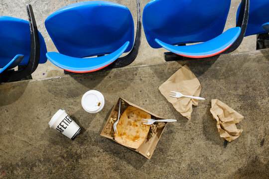 garbage on stadium floor 