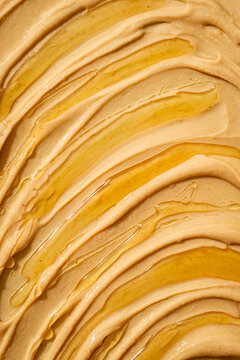 Close-up top view of creamy peanut butter texture