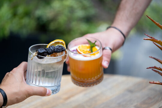 Friends saying toast with cocktails