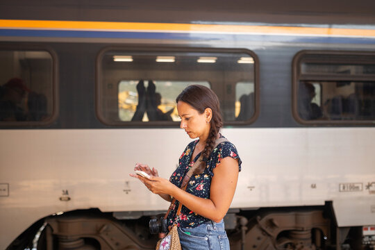 woman waiting for the train at the station