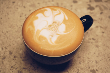 Cups of coffee drink, latte or mocha with milk foam. Standing on the bar counter with a pattern on the coffee.