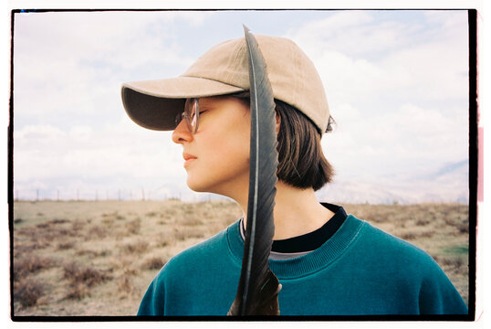 Girl holding eagle feather