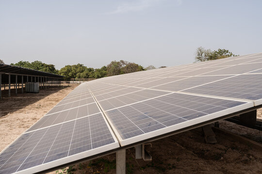 Large solar panel farm generating green energy in senegal - Powered by Adobe