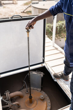 Water plant technician checking tank level in senegal