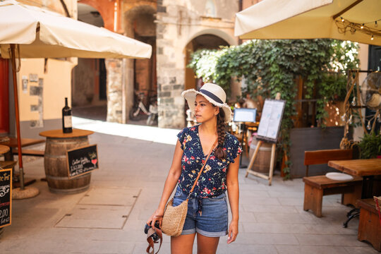 tourist walking along monterosso al mare in cinque terre, italy 