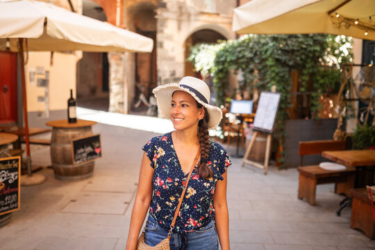tourist walking along monterosso al mare in cinque terre, italy 