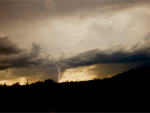 Desert monsoon with lightning bolt