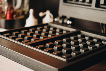 The waffle maker for preparing the most delicious waffles is photographed in the lower plan. On an isolated background.