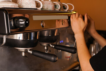 A soft laugh escapes the barista as she chats with a customer, her lighthearted nature complementing her skillful coffee-making.