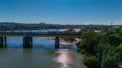 Passenger Train on Bridge over Parramatta River between Rhodes and Meadowbank Sydney NSW Australia. 
