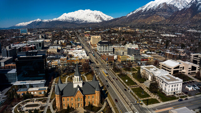 MARCH 2024, PROVO, UTAH - Provo Skyline and main street area is surrounded by snow capped Wasatch Mountains