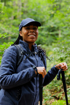 Woman hiking smiling in forest