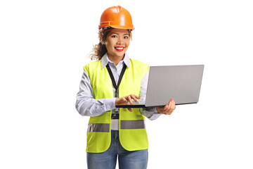 Female asian engineer with a hardhat holding a laptop computer
