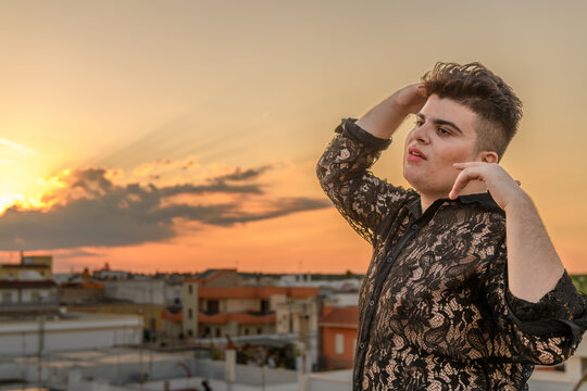 Non-binary person dancing on the roof