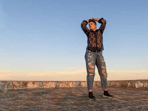 Freedom non-binary person dancing on the roof