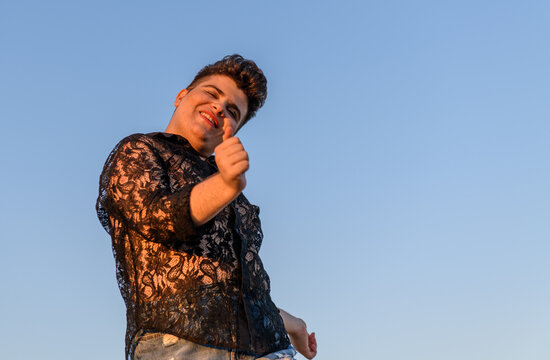 Smiling non-binary person dancing 