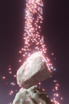 Surreal stones with cascading pink particles