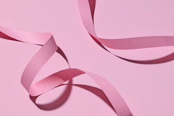 Elegant Pink Ribbon on Soft Pink Background