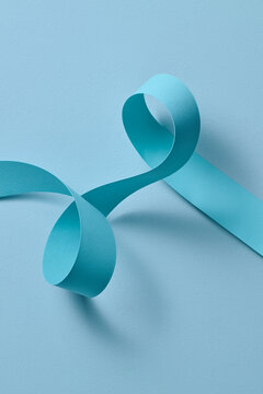 Abstract Blue Ribbon Curves on Light Blue Background