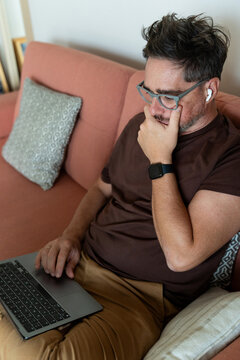  Focused on Laptop with Hand on Chin