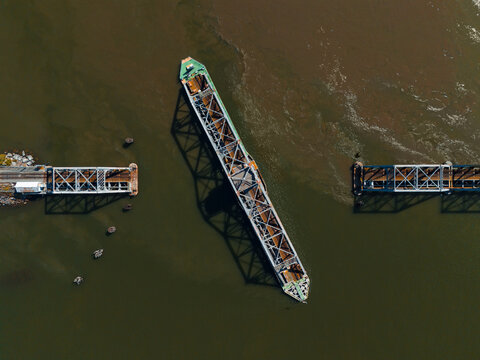 Aerial View of Railroad Bridge Section Floating in the River