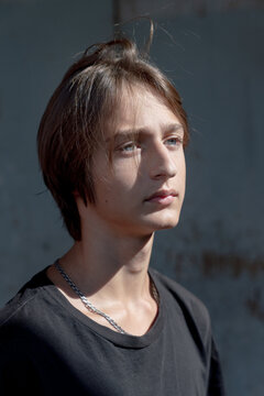 Close-up portrait of a young man in sunlight